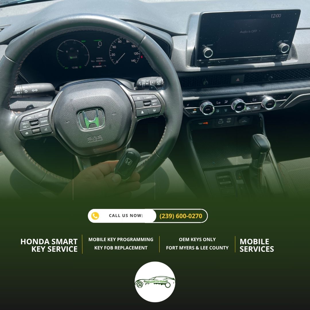 Locksmith holding a Honda key fob inside the vehicle while programming a new smart key in Fort Myers.